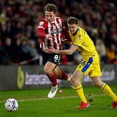 Blackburn Rovers' Darragh Lenihan battles for the ball with Sheffield United's Sander Berge in the Championship game at Bramall Lane earlier this year. Picture: Mike Egerton/PA.