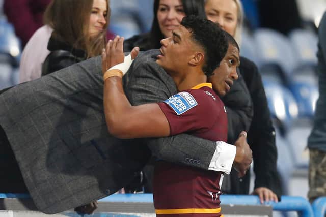 Will Pryce embraces dad Leon at the end of a game. (Picture: SWPix.com)