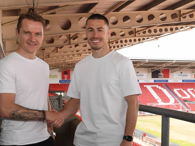 Gary McSheffrey welcomes Tommy Rowe after signing a two year contract with an option of a extra year. Picture: Howard Roe/AHPIX Ltd