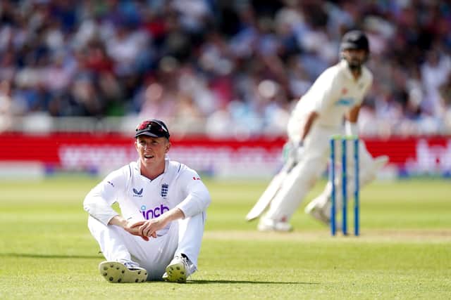 England's Zak Crawley sits after dropping a catch during day one at Trent Bridge Picture: Mike Egerton/PA