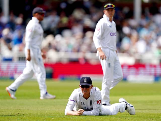 England's Zak Crawley on the ground after dropping the ball during day one of the Second Test at Trent Bridge Picture: Mike Egerton/PA