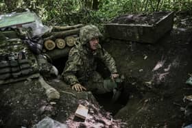 A Ukrainian soldier emerges from an underground makeshift bunker after a shelling  in the eastern Ukraine region of Donbas this week. Picture: ARIS MESSINIS/AFP/Getty Images.