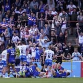 Wakefield Trinity fans celebrate in the stands as Kelepi Tanginoa scores their side's fifth try. Picture: PA