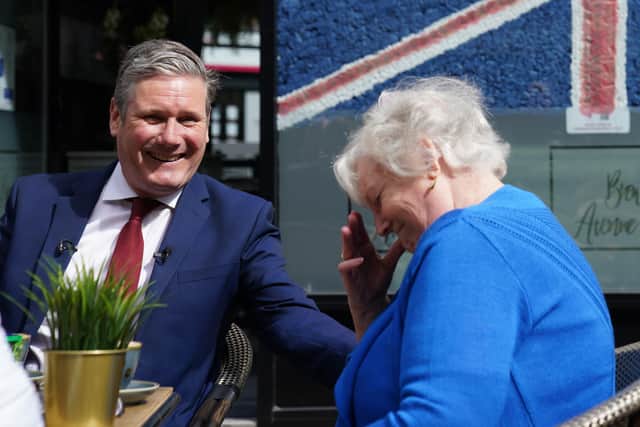 Labour leader Sir Keir Starmer talking to Carole Manders (right) who voted Conservative in 2019 but after feeling let down by the party will be voting labour in the the Wakefield by-election on June 23.