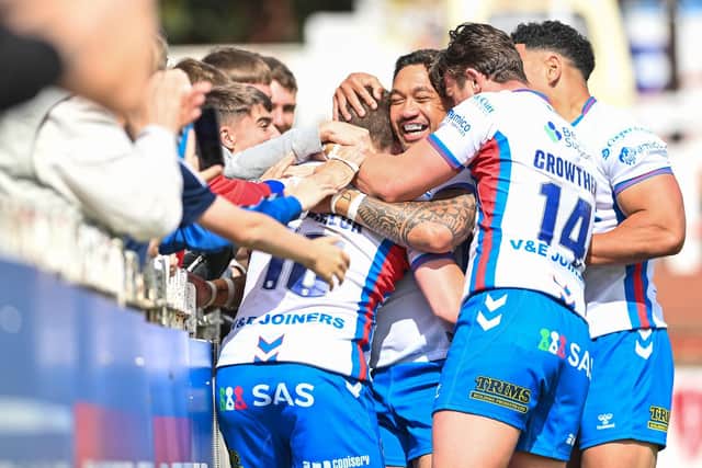Wakefield Trinity celebrate a try with their supporters. (Picture: SWPix.com)