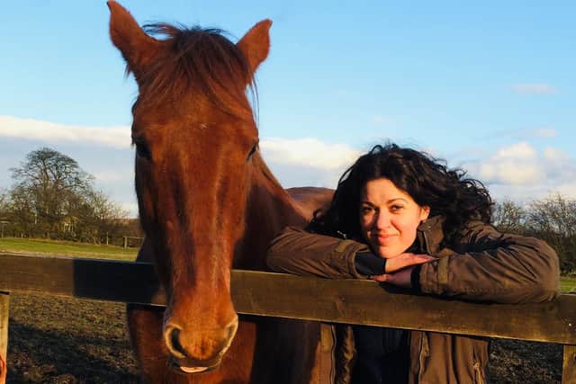 Grace Olson has written a book on how horses helped to heal her heart.