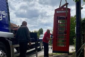 The repurposed phone box is carefully positioned to where it was originally removed. Photo courtesy of Paul Garbutt