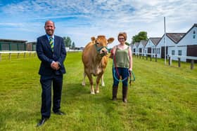 Allister Nixon, Yorkshire Agricultural Society new CEO, meeting freelance stockwoman Jennifer Hyslop, of Barrhill, Ayrshire, holding a Limousin cow. Pic: James Hardisty.