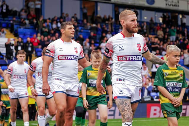 Sam Tomkins leads England out at the Halliwell Jones Stadium. (Picture: SWPix.com)
