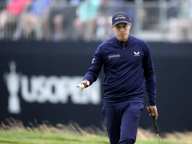 Matthew Fitzpatrick, of England, reacts after putting on the 18th hole during the third round of the U.S. Open golf tournament at The Country Club. (AP Photo/Charlie Riedel)