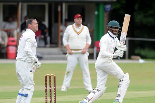 Dan Ranasinghe of New Rover hits the ball to the boundrary against Hall Park in the Aire Wharfe League (Picture: Steve Riding)