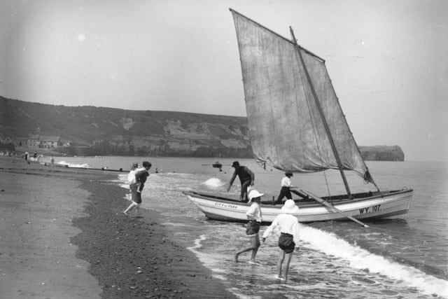 A boat pulls onto the beach at Sandsend, near Whitby, North Yorkshire. (Photo by Hulton Archive/Getty Images)