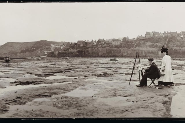 A man with an easel painting a picture of a boat on the deserted beach at Robin Hood's Bay (Photo by Alfred Hind Robinson/A H Robinson/Hulton Archive/Getty Images)