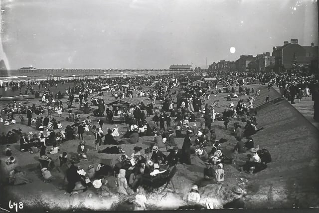 A beach scene at Redcar, the most northerly seaside resort in Yorkshire. The pier, 1,300 feet in length, is in the background. (Photo by Hulton Archive/Getty Images)