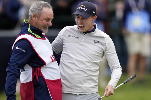 Emotional victory: Matt Fitzpatrick of Sheffield, right, embraces caddie Billy Foster of Bingley as the duo celebrated the former’s US Open victory at Brookline on Sunday night. (Picture: AP/Robert F. Bukaty)