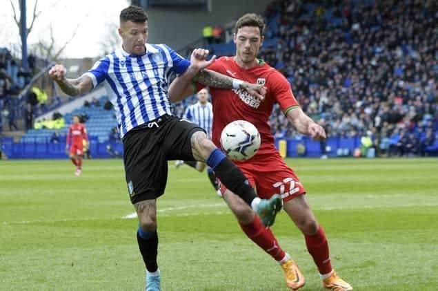 Sheffield Wednesday signing Ben Heneghan, pictured in action against his new club for AFC Wimbledon at Hillsborough last season. Picture: Steve Ellis.