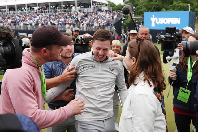 Matt Fitzpatrick is congratulated on his victory as he walks off the 18th green. (Photo by Rob Carr/Getty Images)