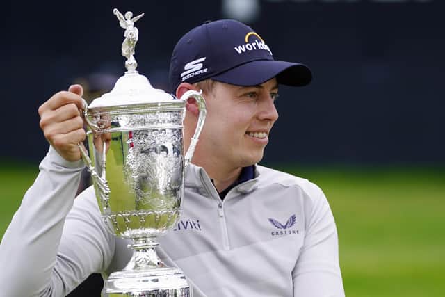 Matthew Fitzpatrick, of England, poses with the trophy after winning the U.S. Open golf tournament at The Country Club, Sunday, June 19, 2022, in Brookline, Mass. (AP Photo/Julio Cortez)