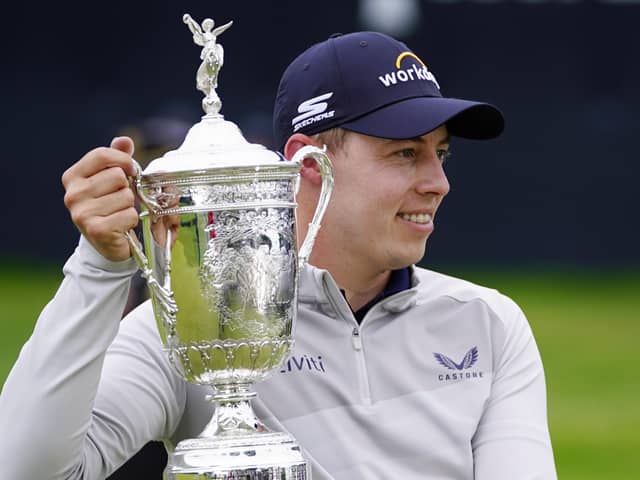 Matthew Fitzpatrick, of England, poses with the trophy after winning the U.S. Open golf tournament at The Country Club, Sunday, June 19, 2022, in Brookline, Mass. (AP Photo/Julio Cortez)