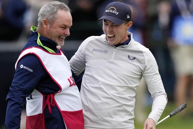 Matthew Fitzpatrick, of England, celebrates with his caddie Billy Foster after winning the U.S. Open golf tournament at The Country Club, Sunday, June 19, 2022, in Brookline, Mass. (AP Photo/Robert F. Bukaty)