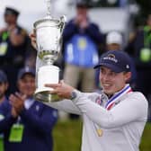 Matthew Fitzpatrick, of England, celebrates with the trophy after winning the U.S. Open golf tournament at The Country Club, Brookline, Mass. (AP Photo/Julio Cortez)