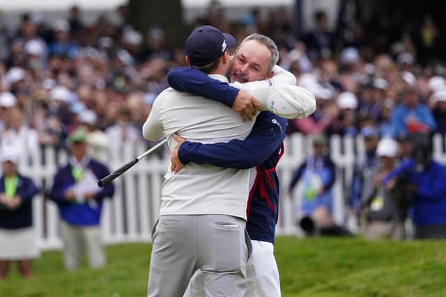 Matthew Fitzpatrick, left, of England, celebrates with his caddie Billy Foster after winning the U.S. Open golf tournament. (AP Photo/Julio Cortez)