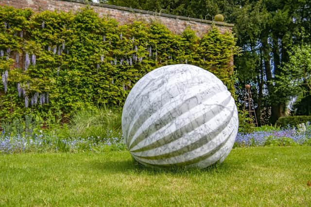 Tim Pomeroy’s Butterfly Egg made of Carrara marble in the gardens.
