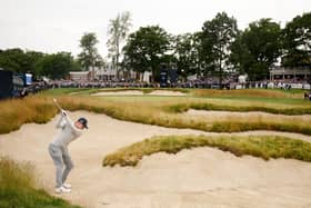 WHAT A SHOT: Matt Fitzpatrick lines up his approach from a bunker on the 18th hole. Picture: Getty Images.