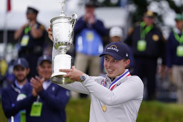 Matthew Fitzpatrick, of England, celebrates with the trophy after winning the U.S. Open golf tournament at The Country Club, Sunday, June 19, 2022, in Brookline, Mass. (AP Photo/Julio Cortez)