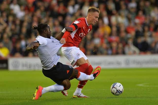 Barnsley captain Cauley Woodrow, pictured in action against Luton at Oakwell early last season. The Reds striker has now moved to the Bedfordshire club. Picture: Jonathan Gawthorpe.