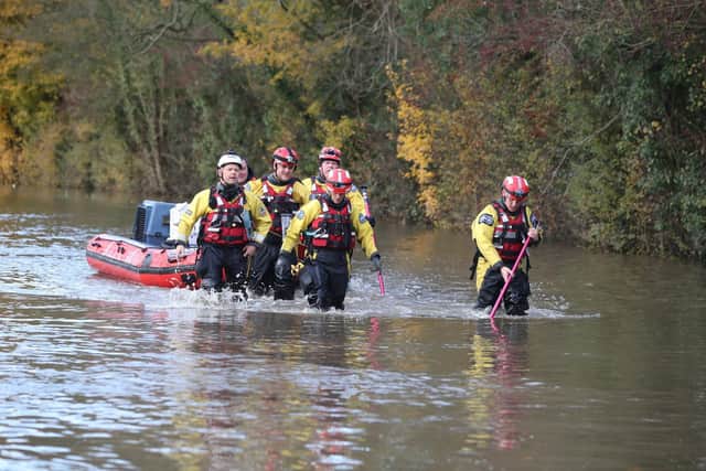 Rescuers pull a boat through floodwater in Fishlake in 2019. Picture: Danny Lawson/PA Wire