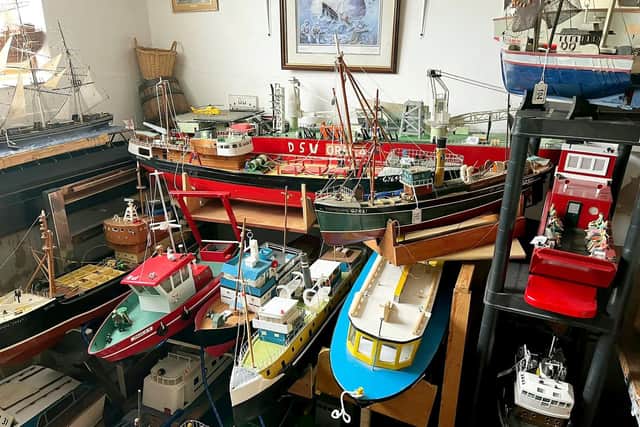 The 75-year-old showed collectors around his boats on the day of the auction