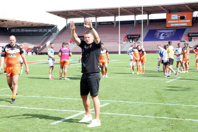 Lee Radford salutes the travelling Castleford Tigers supporters after the win in Toulouse. (Picture: SWPix.com)