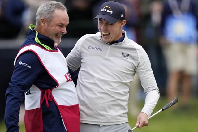Matthew Fitzpatrick, of England, celebrates with his caddie after winning the U.S. Open golf tournament at The Country Club, Sunday, June 19, 2022, in Brookline, Mass. (AP Photo/Robert F. Bukaty)