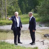 Prime Minister Boris Johnson with German Chancellor Olaf Scholz walking through the grounds during the G7 summit in Schloss Elmau, in the Bavarian Alps, Germany.