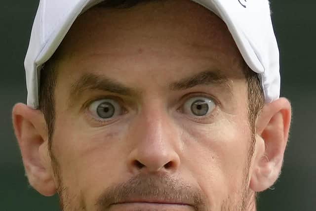 Britain's Andy Murray eyes the ball before playing a return to Australia's James Duckworth. (AP Photo/Kirsty Wigglesworth)