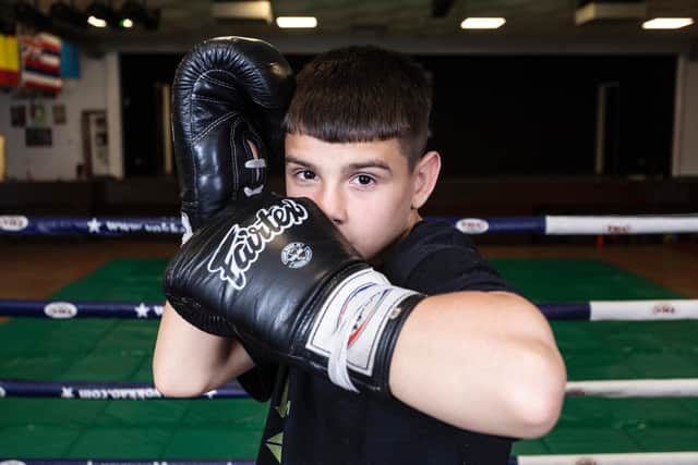 The young fighter has set his sights on becoming a world champion in MMA when he is older, pictured at Outkast Academy.