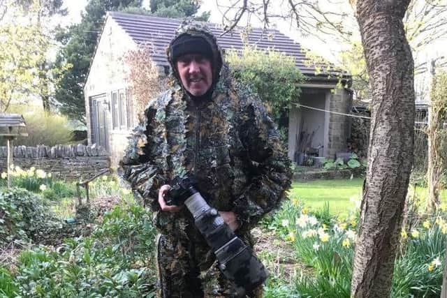 David Driver, 64, had disguised himself as a bush when he captured the shots.