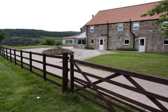 The B&B is located in Harwood Dale, with scenic views surrounding it.