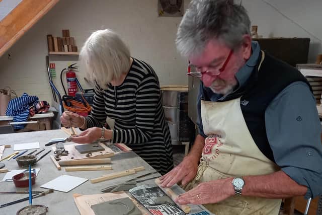 Gerry and Lyn Grant at Fangfoss Pottery work on the tiles. Photo submitted
