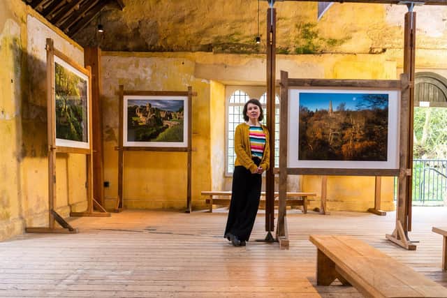 Alexa Vernon, Marketing Manager for Fountains Abbey and Studley Royal viewing the amazing photographs on display within Fountains Mill.