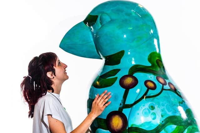 Hull artist Hannah Van Green, with her hand-painted Puffin sculpture titled  'Kelp'.