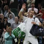 Britain's Andy Murray waves after losing against John Isner. (AP Photo/Alastair Grant)