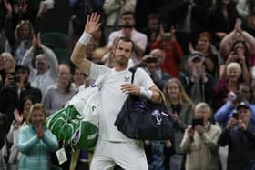 Britain's Andy Murray waves after losing against John Isner. (AP Photo/Alastair Grant)