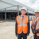 Business Minister Lee Rowley, left, and Sambit Banerjee, managing director of rolling stock and customer services for Siemens Mobility, outside the new component facility being built at Siemens Mobility’s Goole rail village.