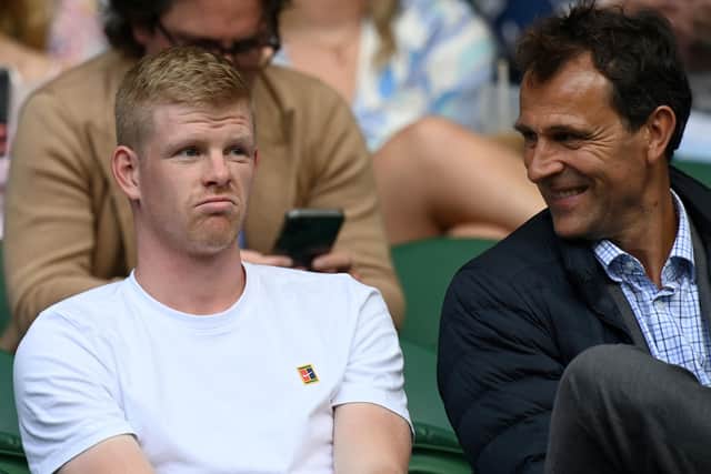 Britain's Kyle Edmund (L) sits on Centre Court on the first day of the 2021 Wimbledon Championships at the The All England Tennis Club in Wimbledon, southwest London, on June 28, 2021(Picture: GLYN KIRK/AFP via Getty Images)