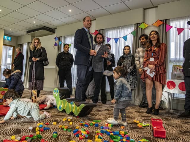 The ‘bridging hotels’ were set up to provide temporary accommodation for refugees after airlifts began from Afghanistan last August, but some refugees are now faced with the prospect of a second autumn and winter without a permanent resettlement.
Pictured: The Duke of Cambridge meeting refugees last year