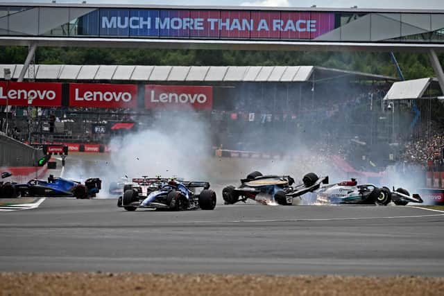 HORROR CRASH: Zhou Guanyu hailed the halo safety device as he walked away virtually unscathed from Sunday's first-lap incident at Silverstone. Picture: Getty Images.