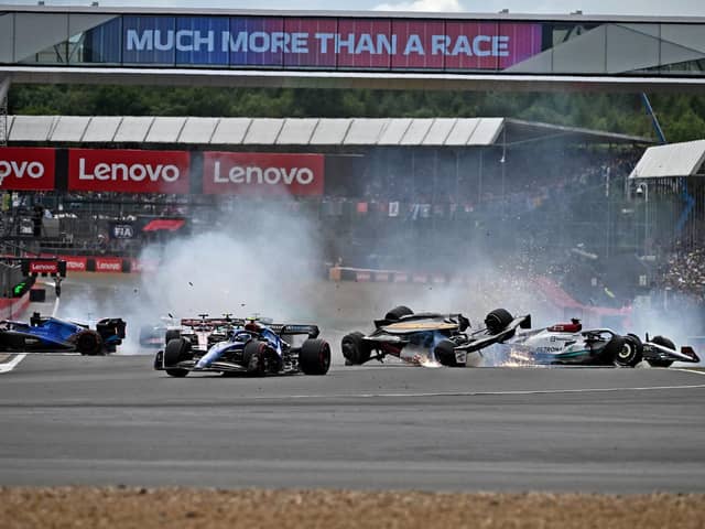 HORROR CRASH: Zhou Guanyu hailed the halo safety device as he walked away virtually unscathed from Sunday's first-lap incident at Silverstone. Picture: Getty Images.
