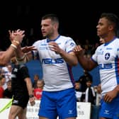 Jow' about that: Trinity's Max Jowitt, celebrates scoring a try with team-mates Jordan Crowther, and Corey Hall, of Wakefield Trinity. Picture: James Hardisty